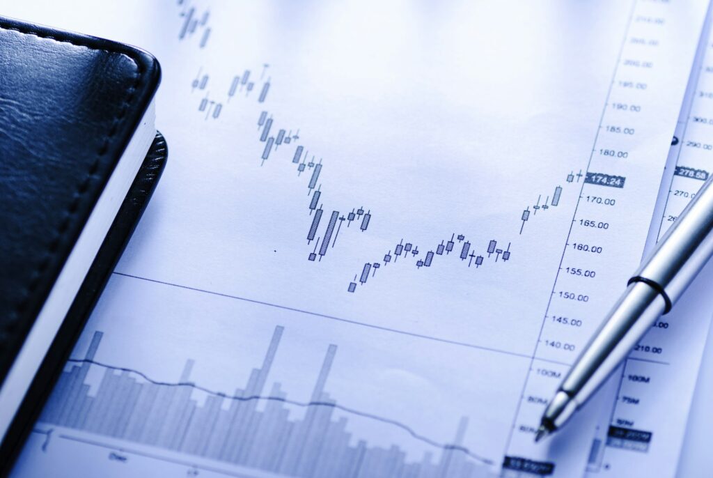 Open journal with business graphs and pen